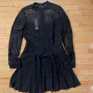 Stunning brand new Adria Moss black lace mini dress